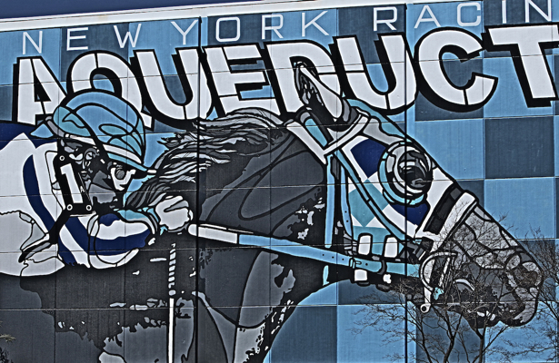 Vibrant mural depicting a horse and jockey at Aqueduct Racetrack in New York, showcasing racing culture and art.