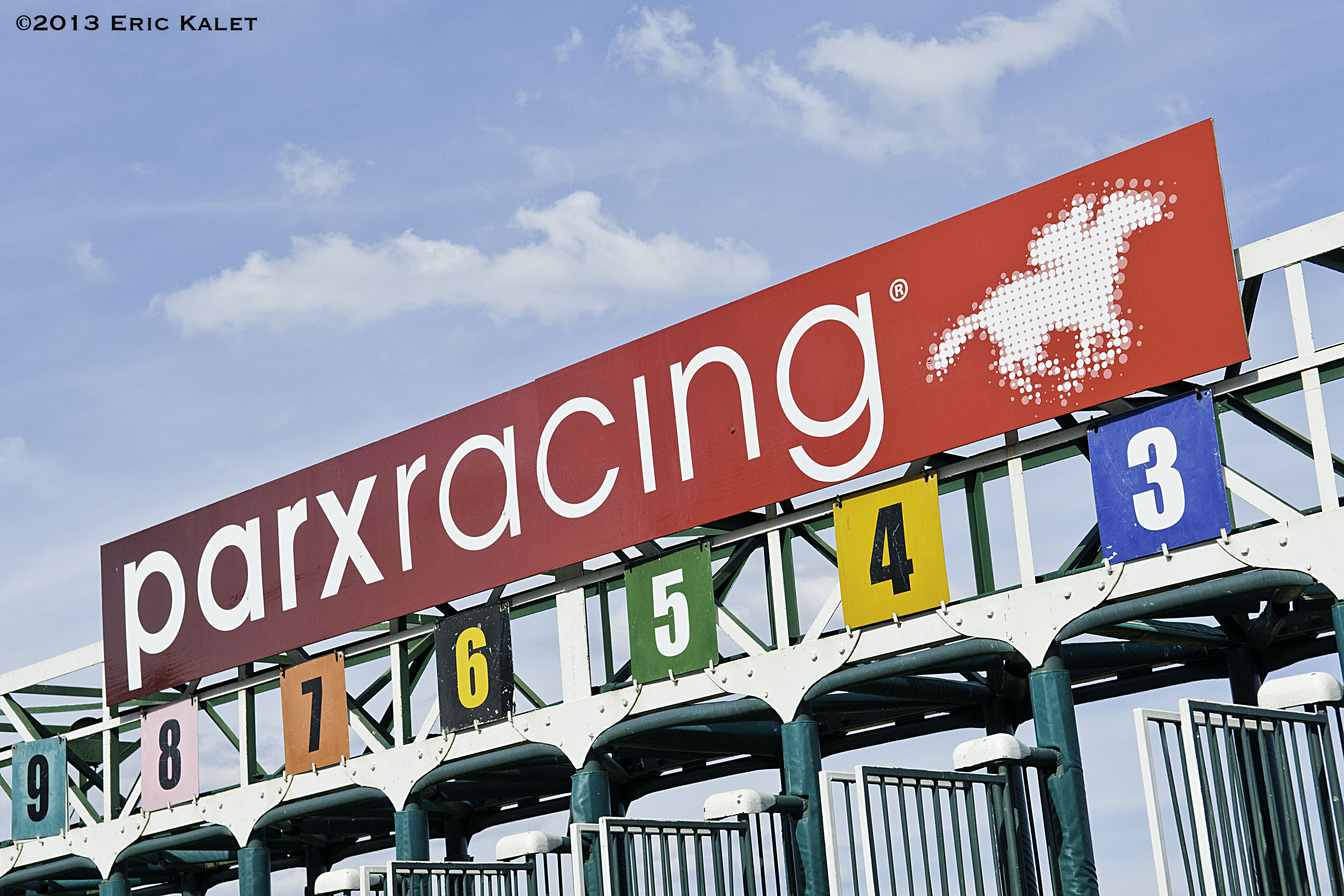 Sign for Parx Racing displayed above starting gate with numbered positions.