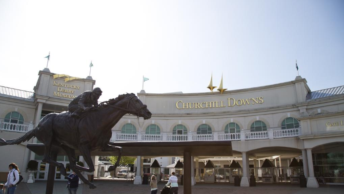 Entrance of Churchill Downs featuring a horse statue and the Kentucky Derby Museum.