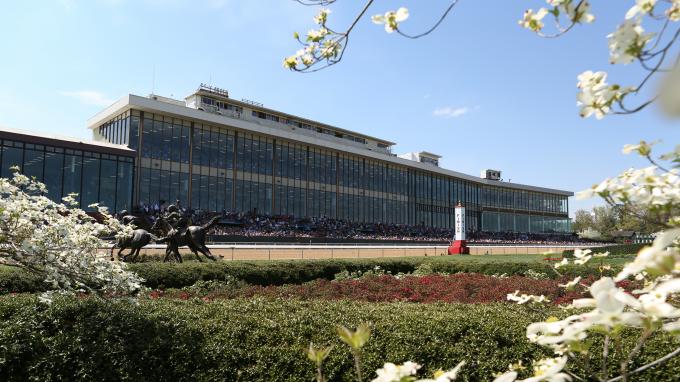 Exterior view of the Oaklawn Racing Casino Resort building with a clear sky above.
